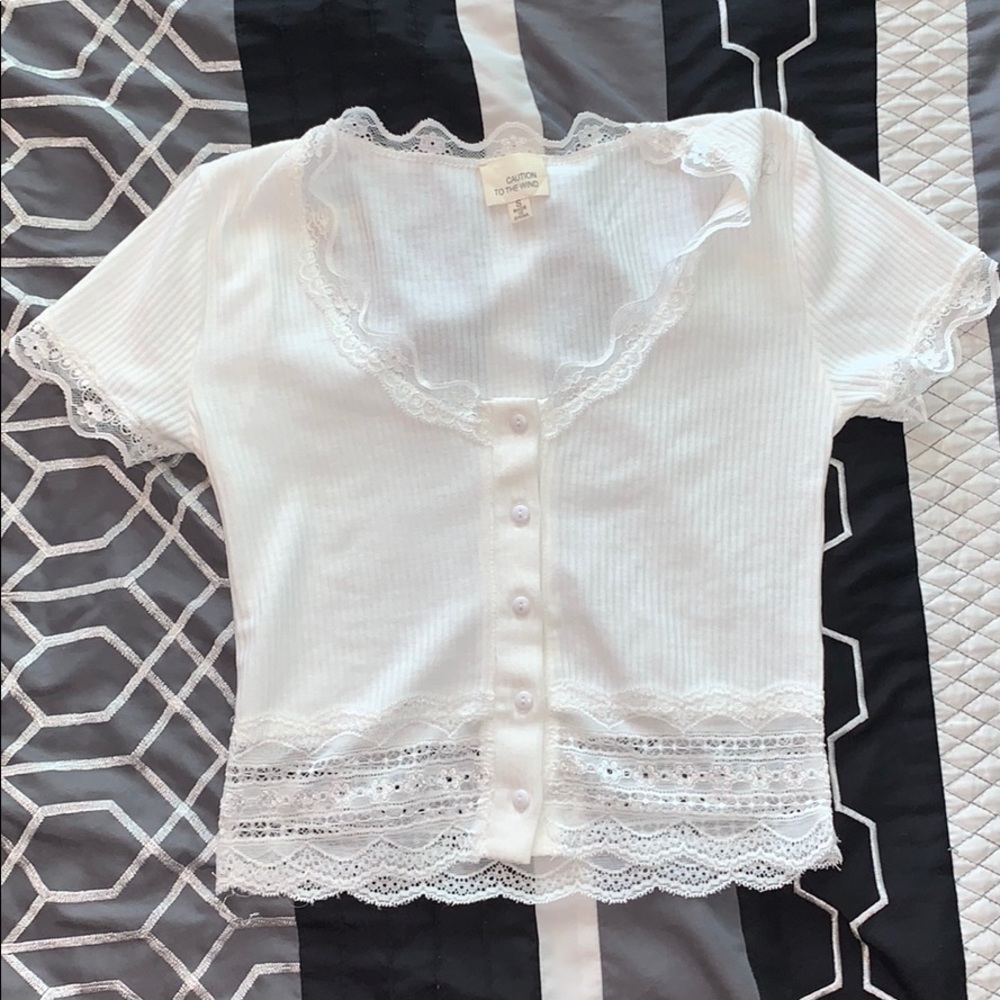 Crop top with lace at the ends.